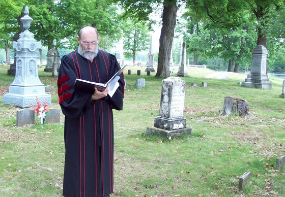 Rev. Barnes in Bayside Cemetery leading annual Memorial Day Weekend service honoring deceased Methodist pastors.